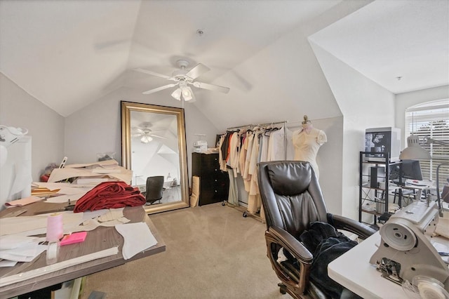 carpeted office featuring vaulted ceiling and ceiling fan