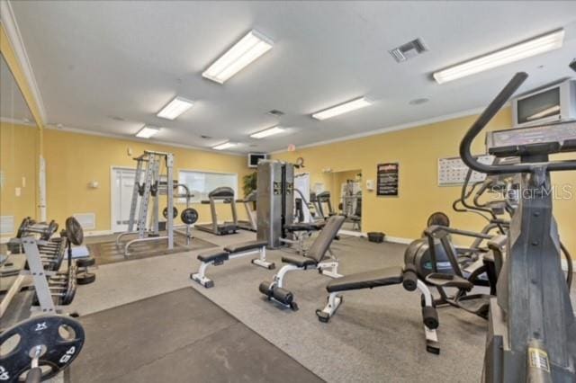 workout area with crown molding