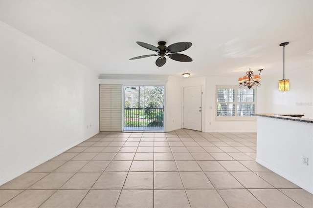 unfurnished living room featuring ornamental molding, light tile patterned floors, and plenty of natural light