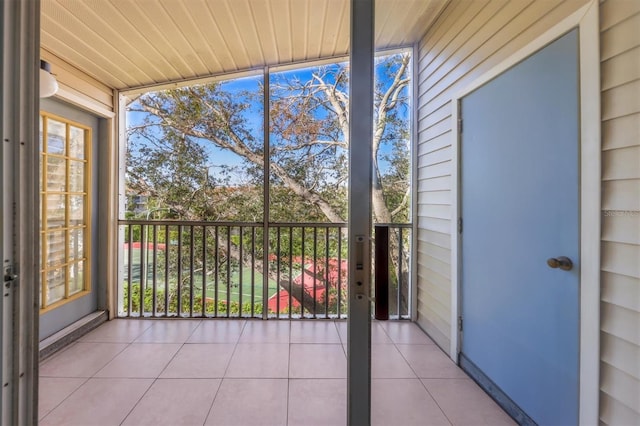 unfurnished sunroom with wooden ceiling