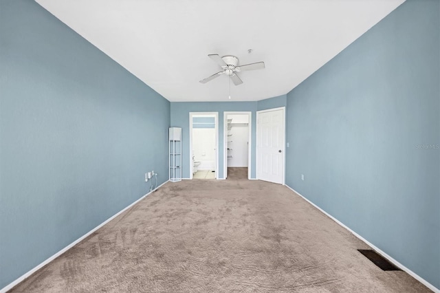 unfurnished bedroom with carpet floors, a closet, and ceiling fan