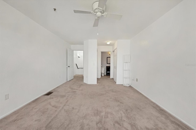 unfurnished bedroom with light carpet and ceiling fan