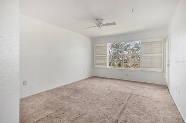 carpeted empty room with ceiling fan