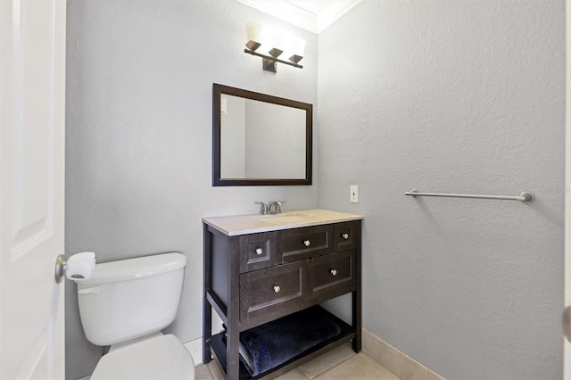 bathroom featuring toilet, crown molding, vanity, and tile patterned flooring