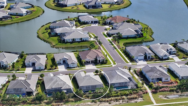 birds eye view of property featuring a water view