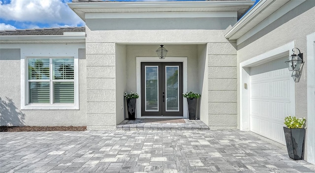 property entrance featuring french doors and a garage