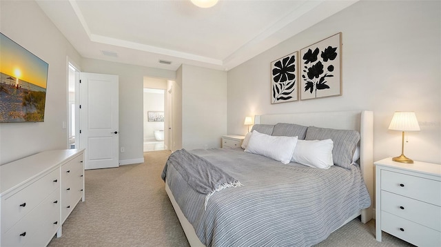 carpeted bedroom featuring connected bathroom