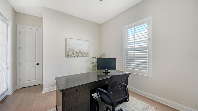 office space with light wood-type flooring