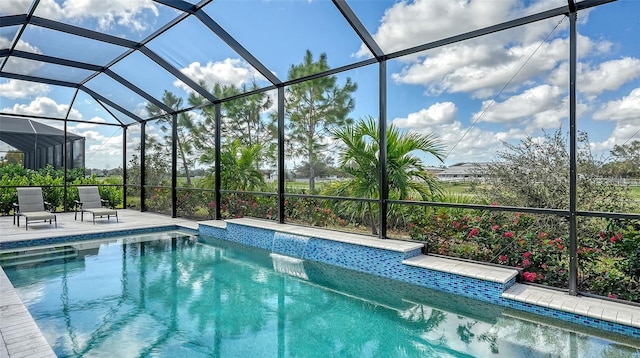 view of pool featuring a patio area and a lanai