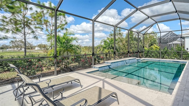 view of pool with a patio, a lanai, and a hot tub