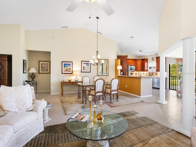 living room featuring ceiling fan with notable chandelier, decorative columns, light colored carpet, and high vaulted ceiling