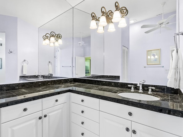 bathroom featuring vaulted ceiling and vanity