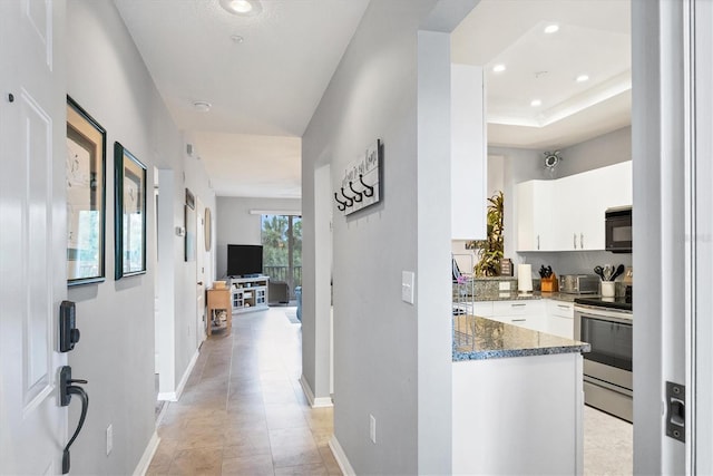 hallway featuring light tile patterned floors