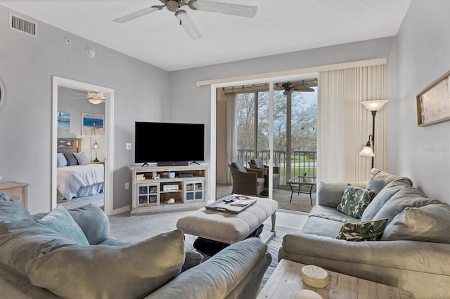 living room with ceiling fan and light carpet