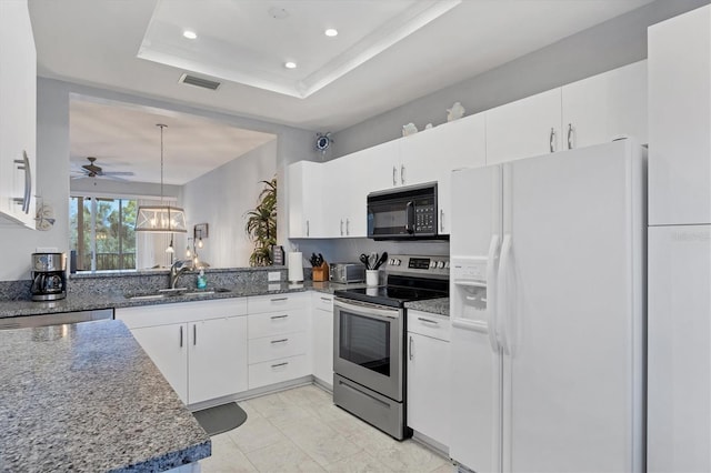 kitchen with stainless steel range with electric cooktop, sink, white refrigerator with ice dispenser, and white cabinets