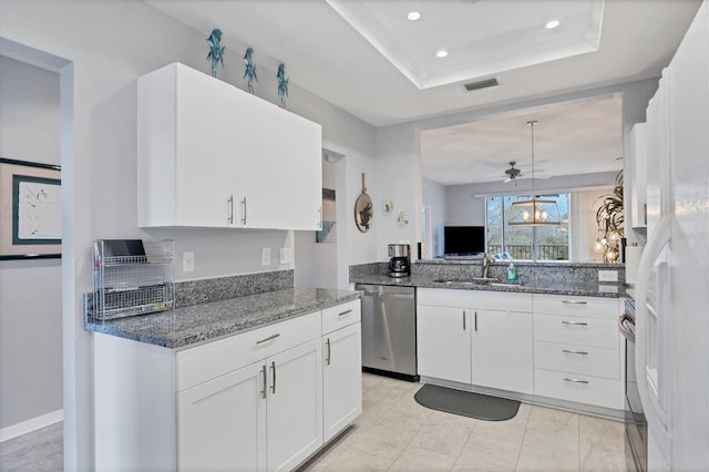 kitchen with pendant lighting, white cabinets, dishwasher, and sink