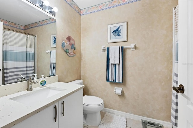 bathroom featuring vanity, toilet, and tile patterned floors