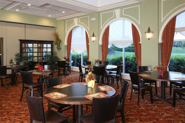 dining area featuring ornamental molding, beam ceiling, and coffered ceiling