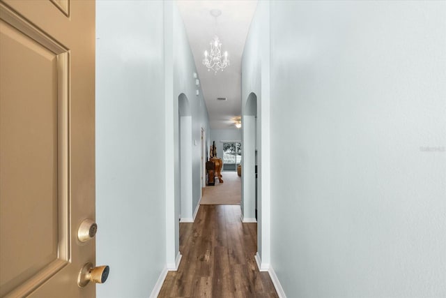 hallway featuring dark hardwood / wood-style flooring