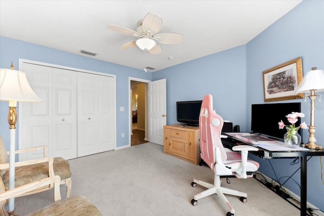 office featuring light carpet and ceiling fan