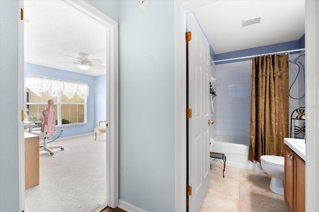 full bathroom with toilet, tile patterned flooring, shower / bath combo with shower curtain, vanity, and ceiling fan