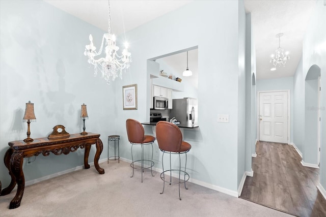 interior space featuring a chandelier and light wood-type flooring