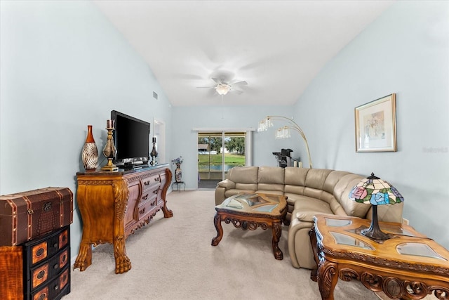 living room with vaulted ceiling, light carpet, and ceiling fan