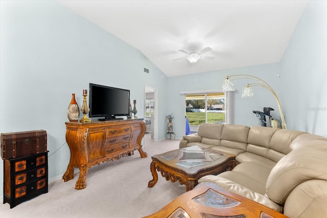 carpeted living room featuring ceiling fan and vaulted ceiling