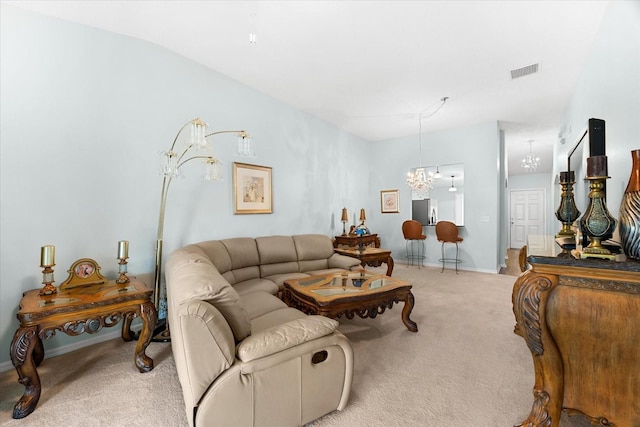 carpeted living room featuring lofted ceiling and a chandelier