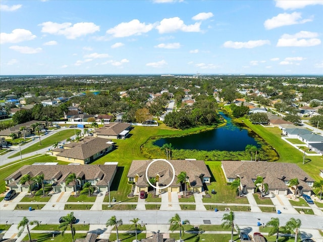 drone / aerial view with a water view