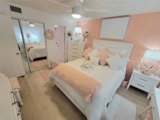 bedroom featuring ceiling fan and light wood-type flooring