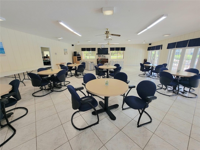 dining room featuring light tile patterned floors and ceiling fan