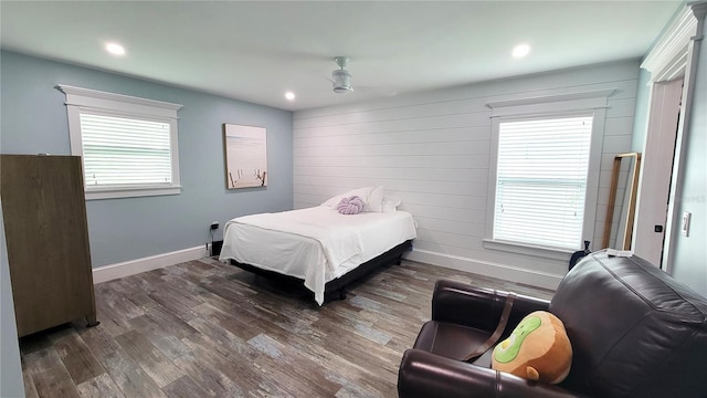 bedroom with ceiling fan and dark hardwood / wood-style floors