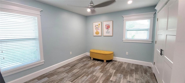 living area featuring ceiling fan and hardwood / wood-style floors