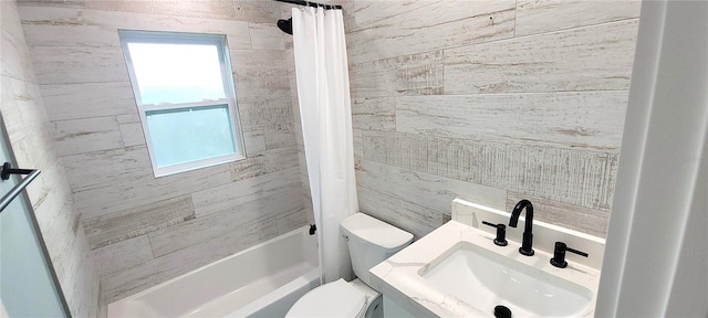 full bathroom featuring vanity, shower / tub combo, and toilet