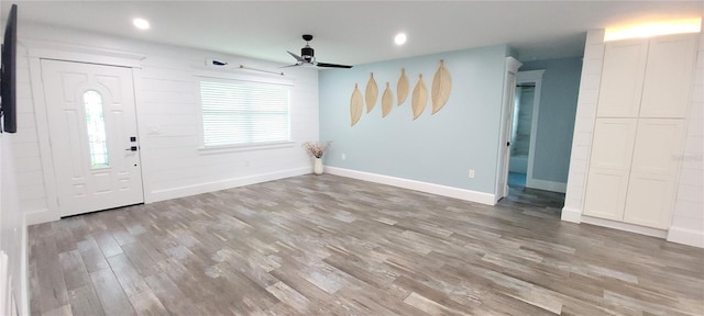 foyer featuring wood-type flooring and ceiling fan