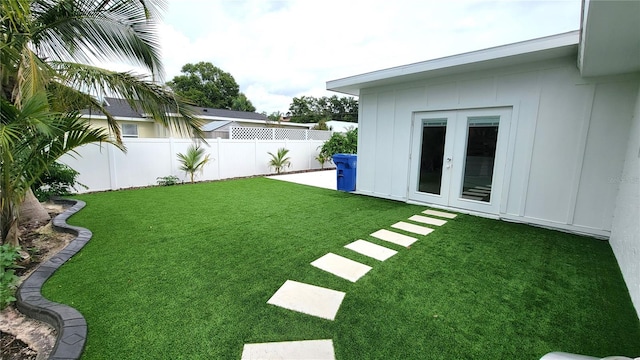 view of yard featuring french doors