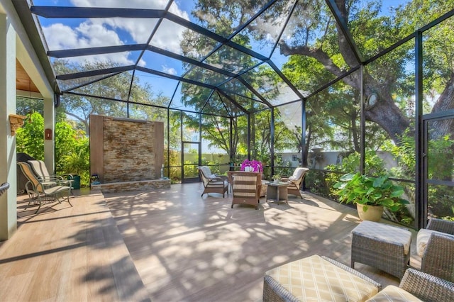 view of patio featuring an outdoor hangout area and a lanai