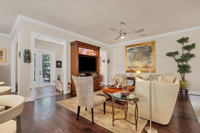 living room with dark wood-type flooring, crown molding, and ceiling fan