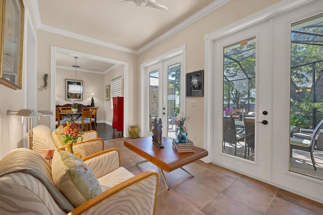 interior space featuring crown molding, light tile patterned flooring, french doors, and ceiling fan