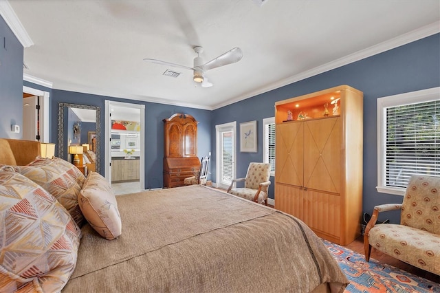 bedroom featuring connected bathroom, crown molding, and ceiling fan