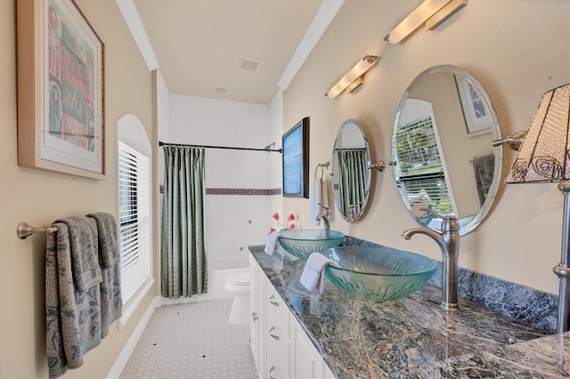 bathroom with vanity, a shower with curtain, toilet, and tile patterned floors