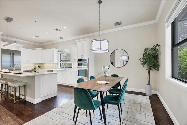1884 Grove St, Sarasota, FL 34239 - dining room featuring dark wood-style flooring, baseboards, crown molding, and recessed lighting