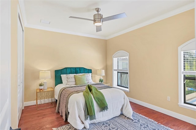 1884 Grove St, Sarasota, FL 34239 - bedroom featuring wood finished floors, crown molding, baseboards, and ceiling fan