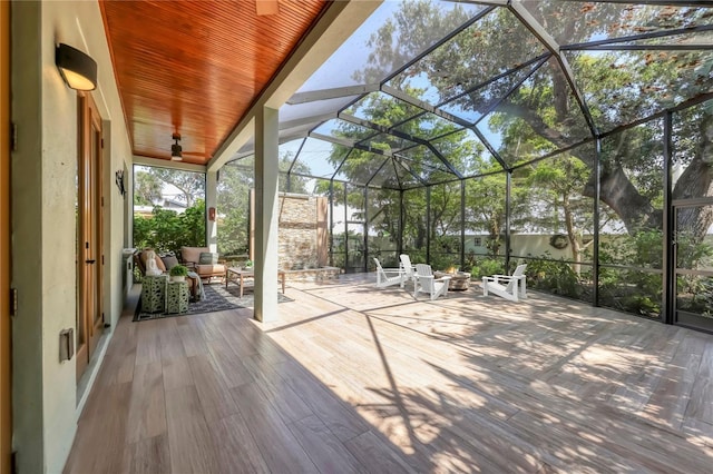 1884 Grove St, Sarasota, FL 34239 - unfurnished sunroom featuring a fire pit, a ceiling fan, and lofted ceiling
