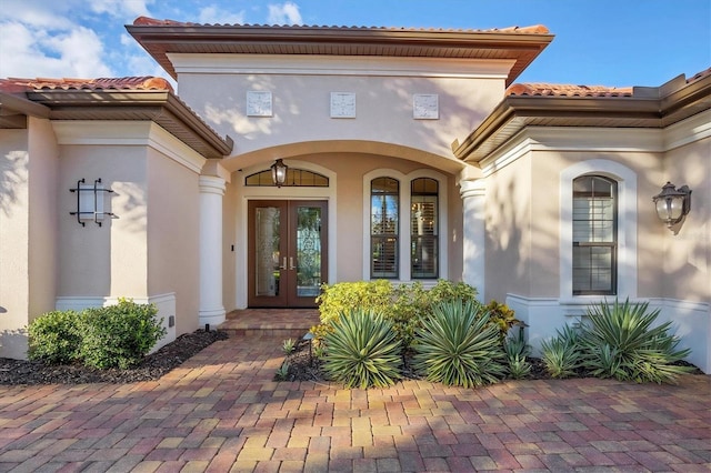 property entrance featuring french doors