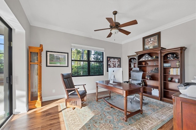 office space with light hardwood / wood-style flooring, ceiling fan, and ornamental molding