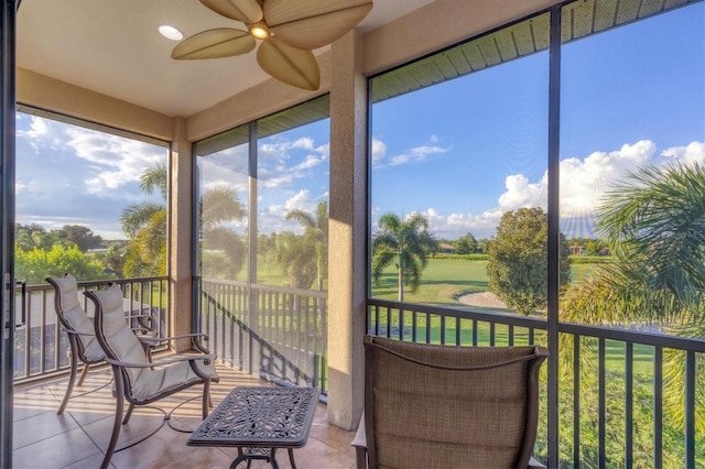 sunroom featuring ceiling fan and a healthy amount of sunlight