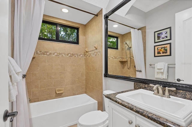 full bathroom featuring shower / tub combo with curtain, vanity, toilet, and plenty of natural light