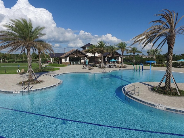 view of swimming pool with a gazebo and a patio area